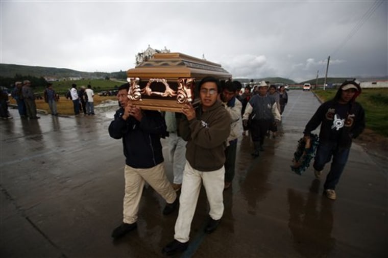Residents carry a coffin containing the remains of a mudslide victim to be buried in Santa Maria Ixtahuacan, Guatemala, Sunday Sept. 5. Torrential rains from a tropical depression caused landslides that have killed at least 38 people in Guatemala. 